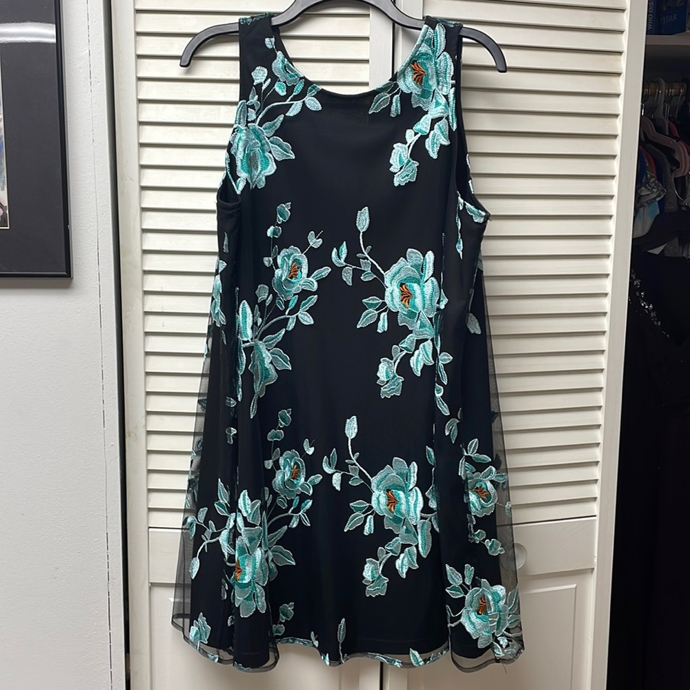 Black sleeveless dress with aqua flowers